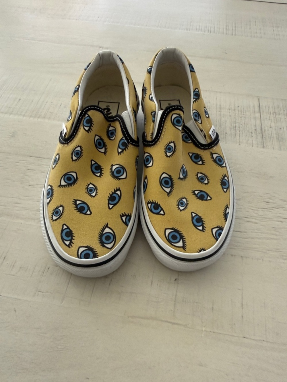 Vans Yellow Slip-On Sneakers with Blue Eye Print